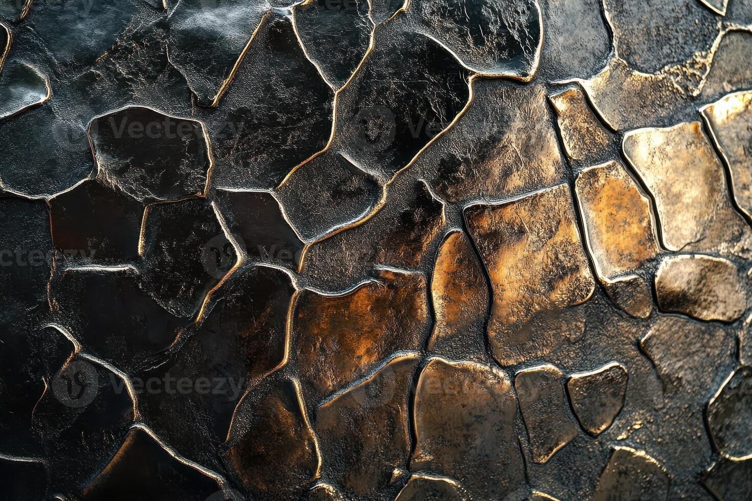 Dark metallic surface shows an abstract irregular paving stone pattern photo