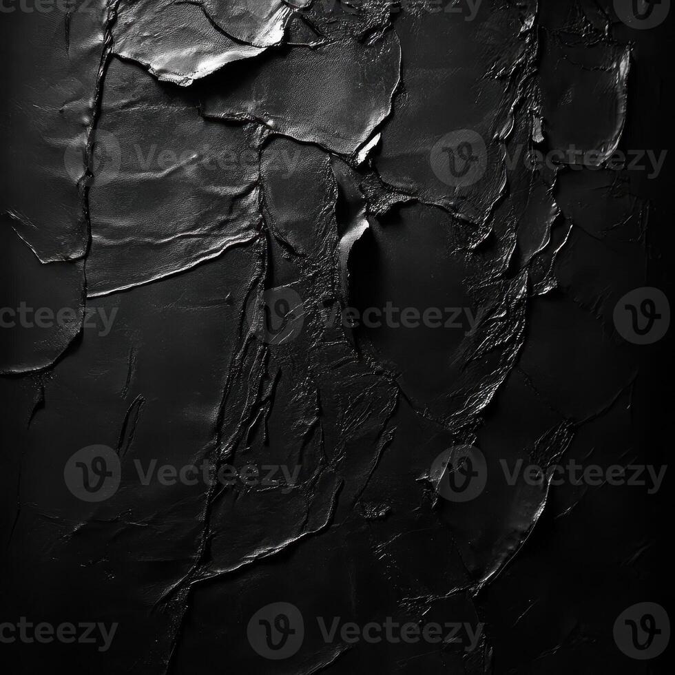 Abstract artwork shows a black textured and layered surface photo