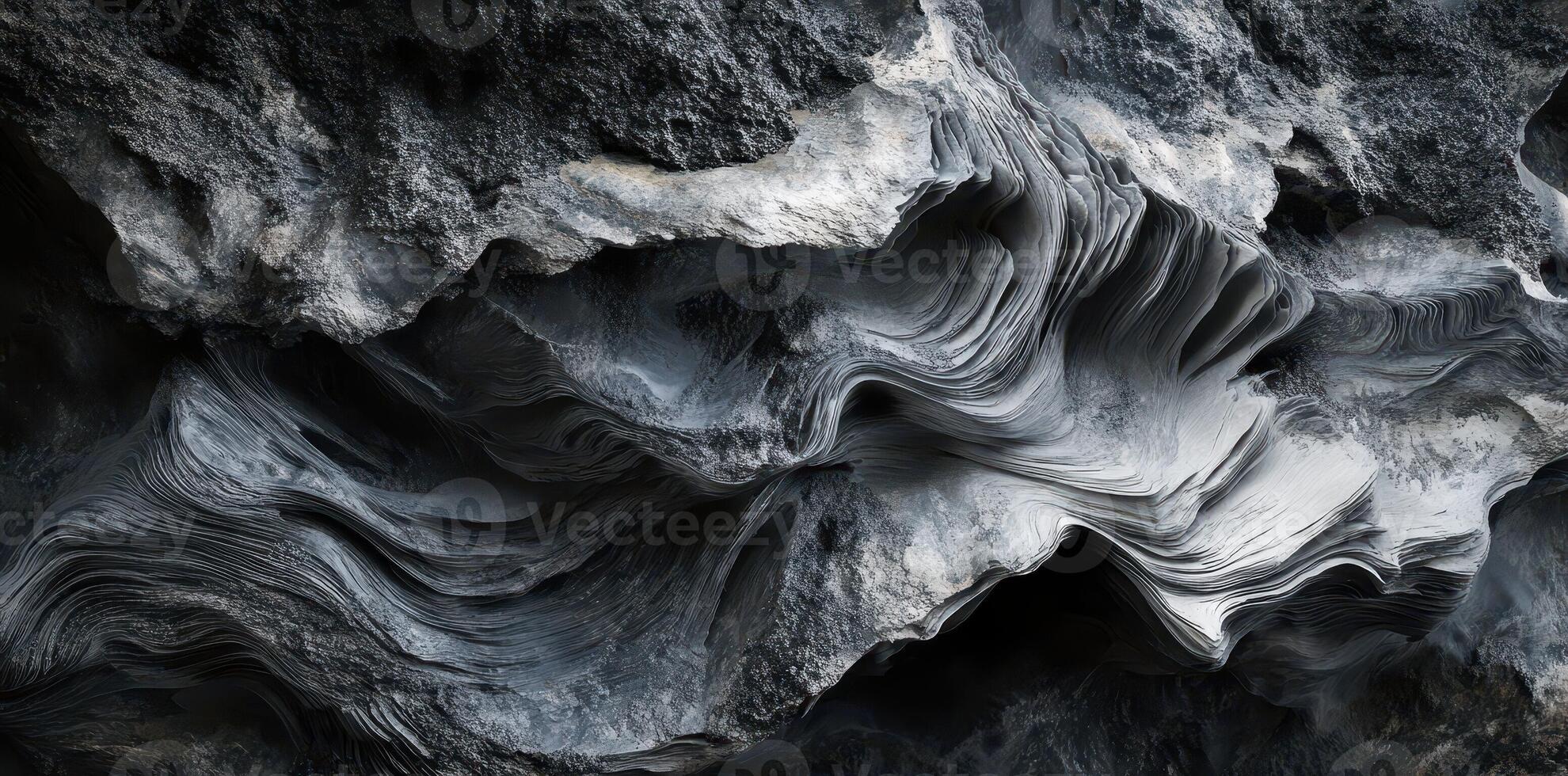Gray stone shows layered textures shaped and eroded over time photo