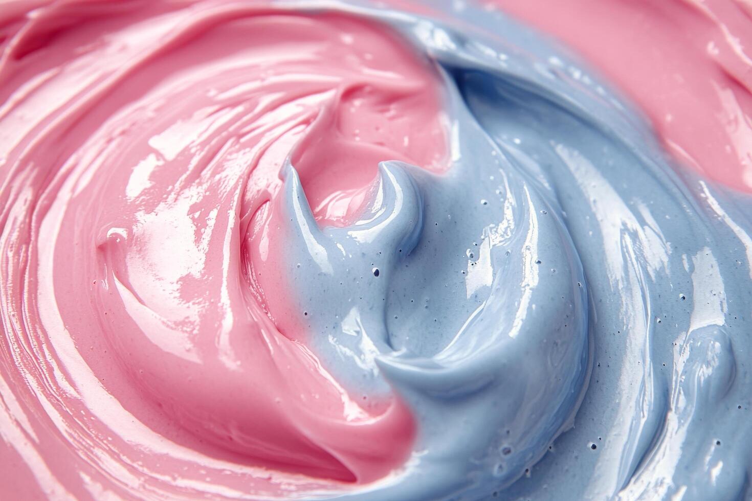 A close up of a blue and pink frosting photo