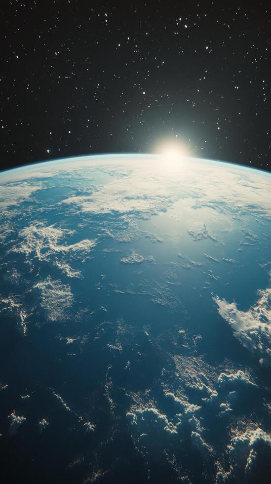 The earth is seen from space with the sun shining photo