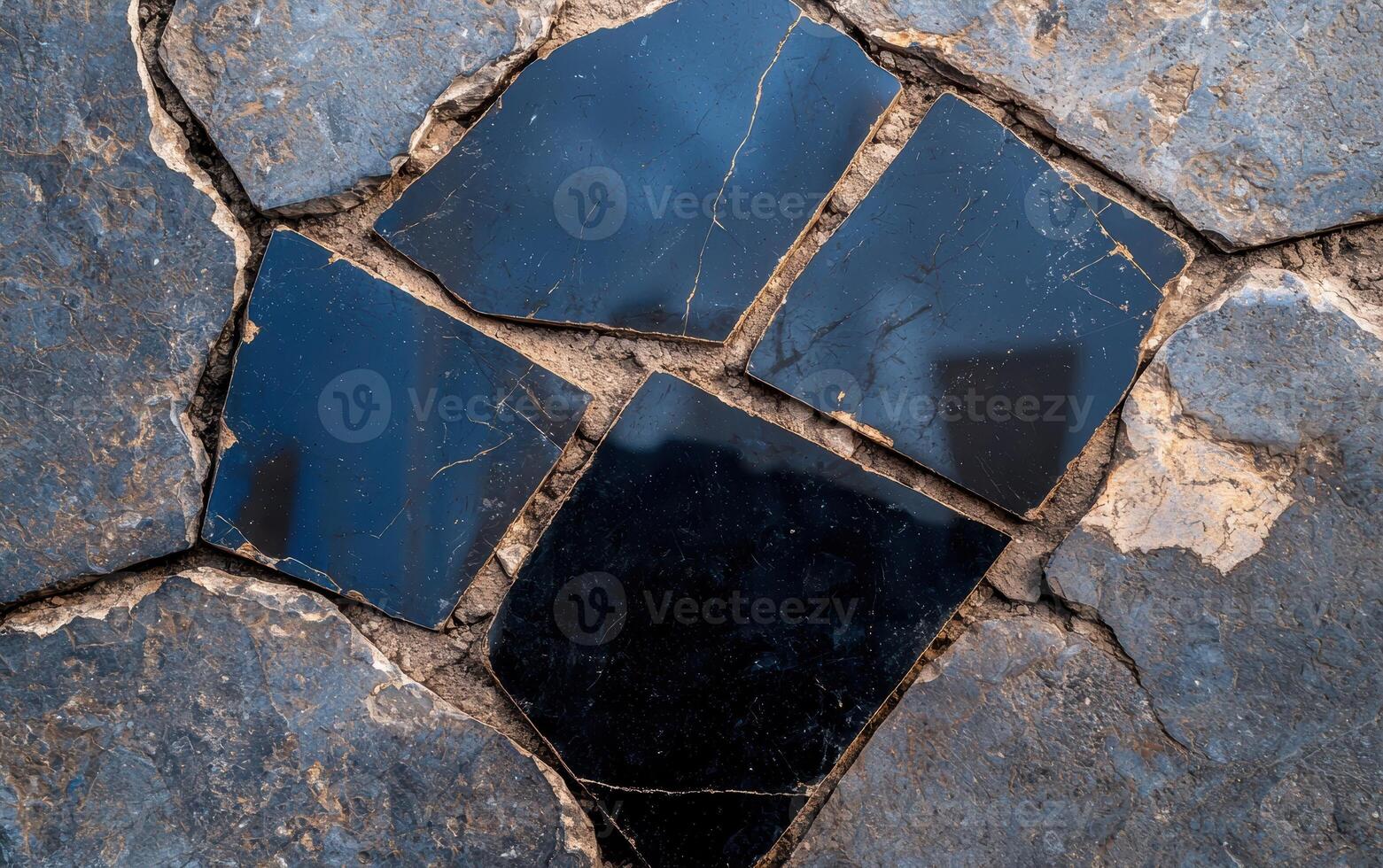Stone pavement with black tiles, creating a textured surface photo