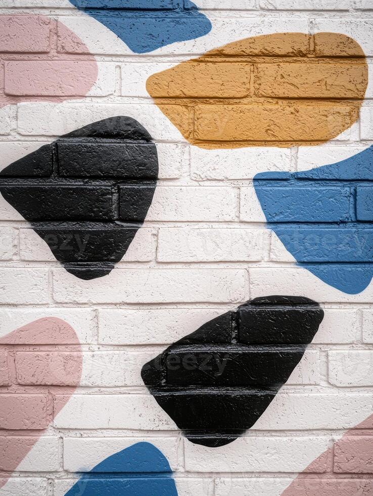 Colorful abstract shapes painted on a brick wall photo