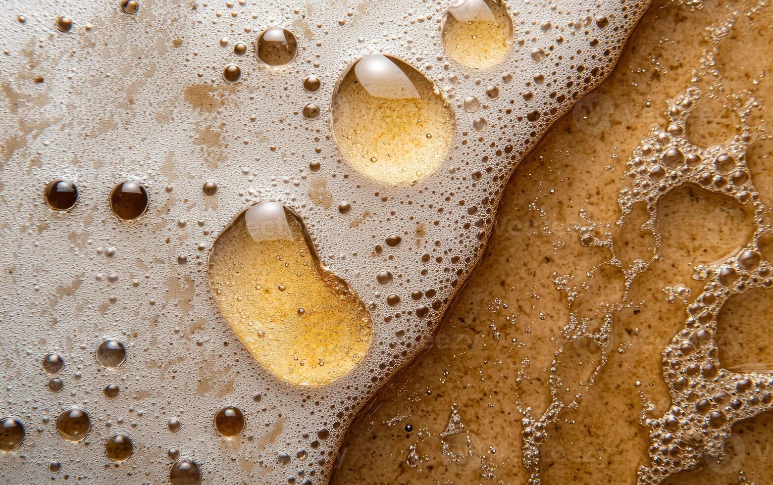 Close up of beer foam and bubbles photo