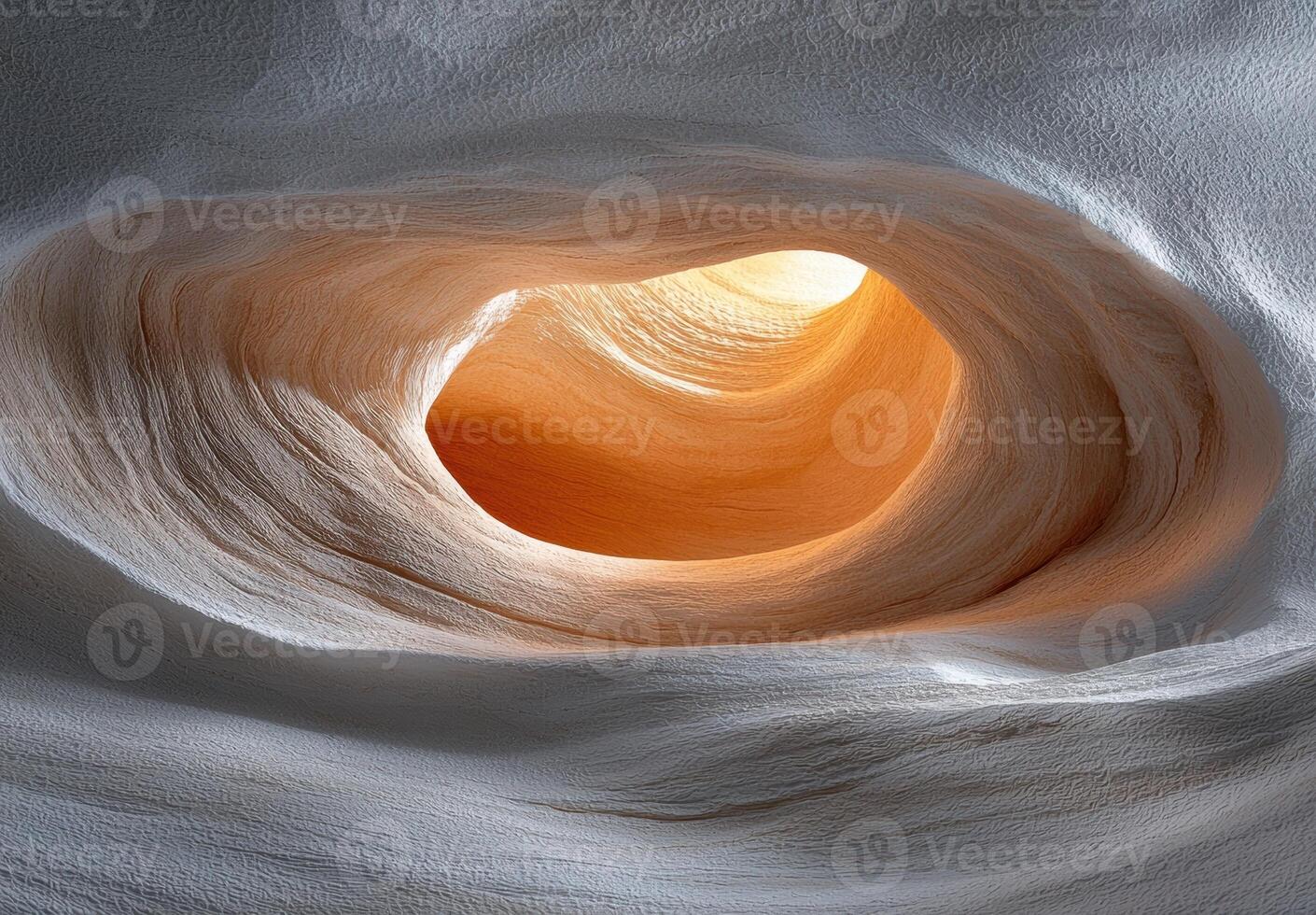 Abstract sandstone cave with light shining through the opening photo