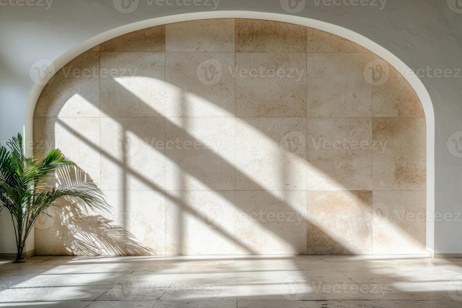 Sunlight streaming through an arched doorway onto a tiled wall and floor photo