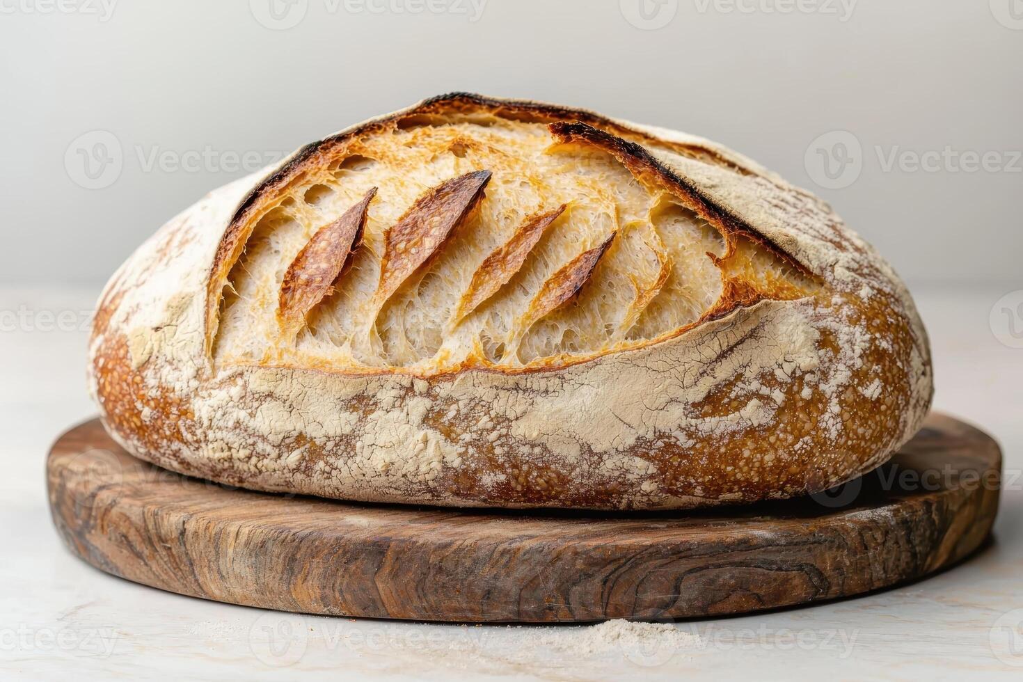 Freshly baked sourdough bread on a wooden board photo
