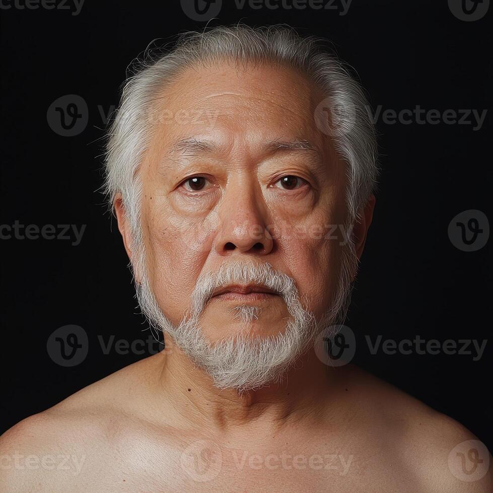 Portrait of an older Asian man with a beard photo