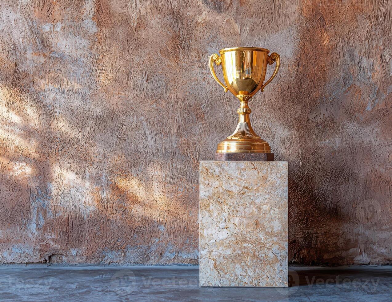 Golden trophy on a marble pedestal against a textured wall, symbolizing success and achievement photo