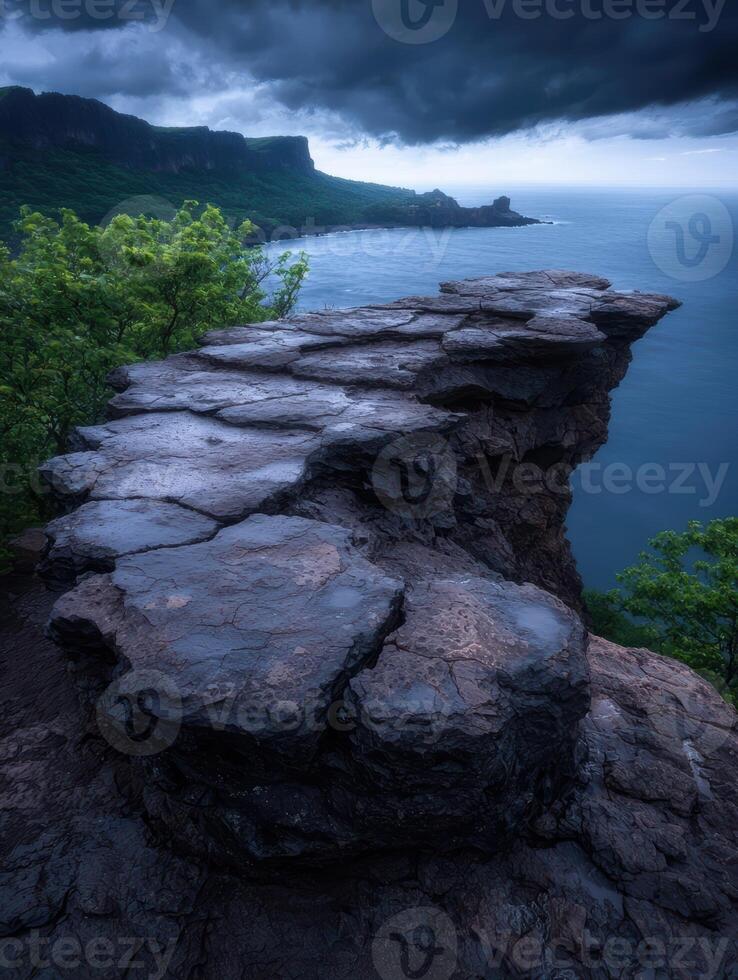 Dramatic coastline view from a rocky cliff edge photo