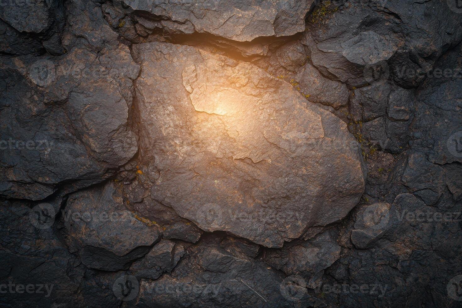 Dark rock texture with light, rough stone background photo