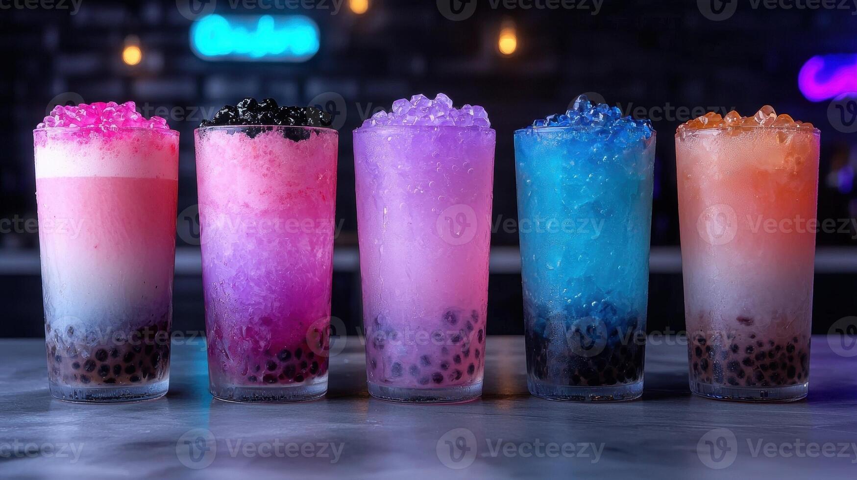 Colorful bubble tea drinks lined up on a bar photo