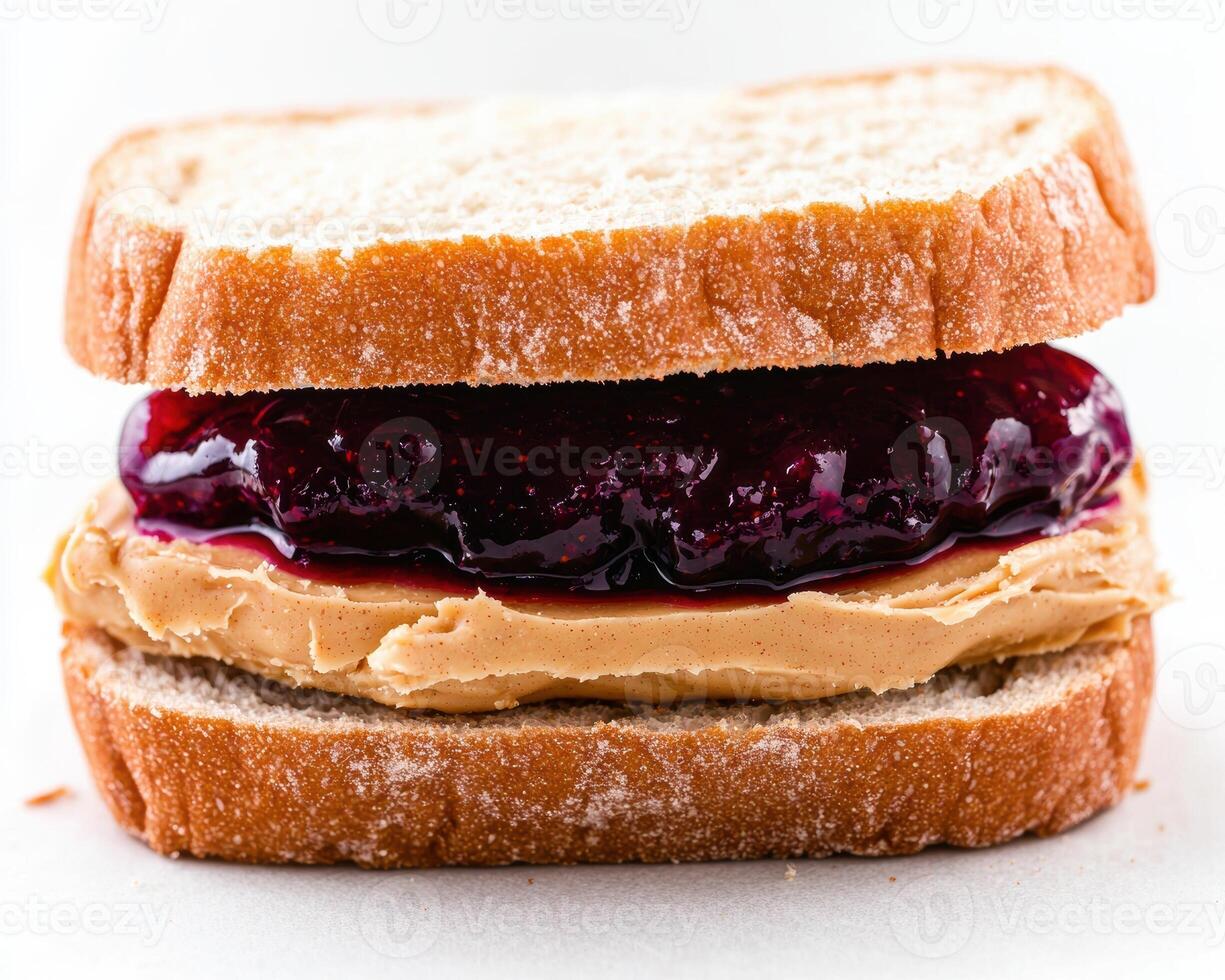 A peanut butter and jelly sandwich on white bread photo