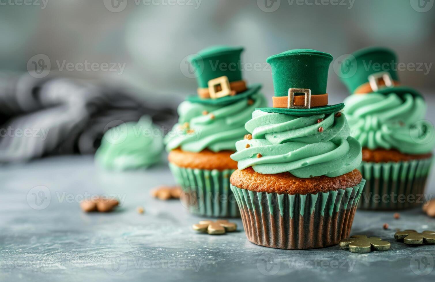 A green cupcake with patricks hat on top. The cupcake is decorated with gold sprinkles and has a green frosting. Patrick's Day sweet dessert for Irish holiday photo