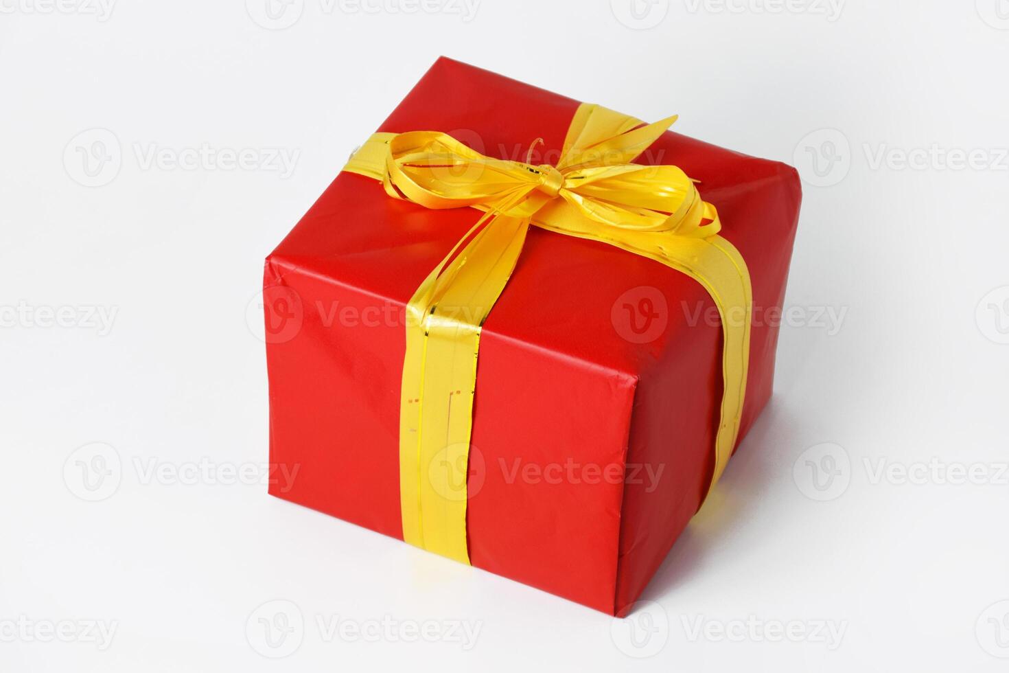 Elegant Christmas and New Year Gift in Red with Gold Ribbon photo