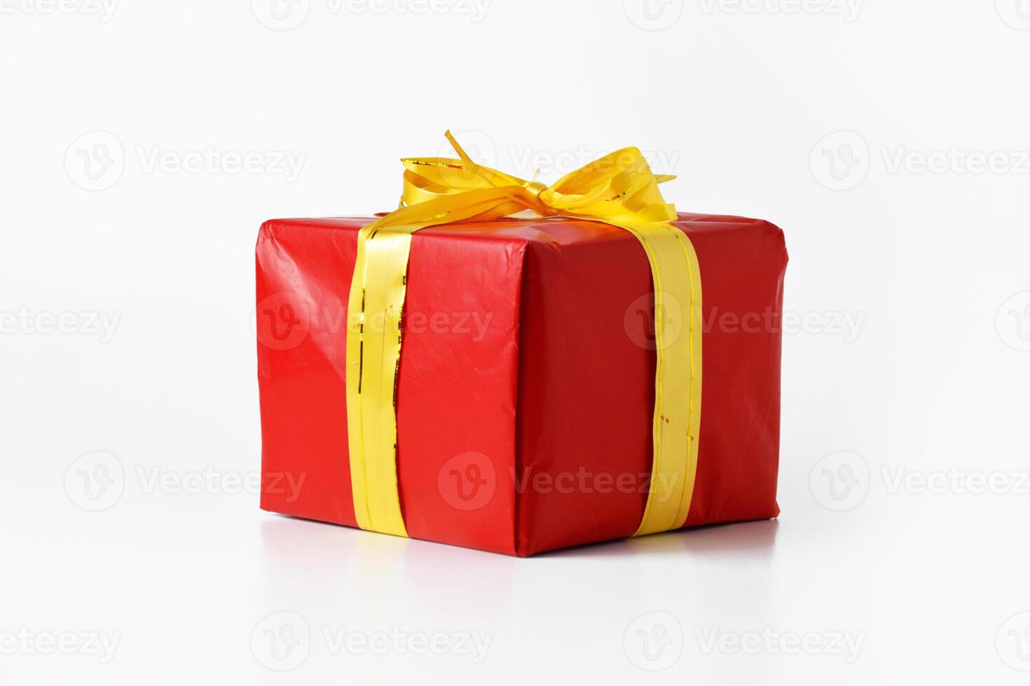 Luxurious Red Gift Box Tied with a Golden Ribbon for the Holidays photo