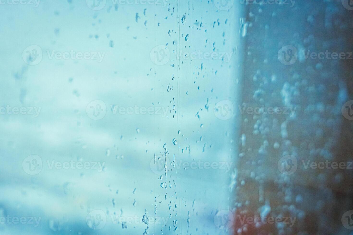 Rainy window view, Drops on glass on rainy cloudy day evoke melancholy and sadness. View of city from the window. Selective focus. High quality photo
