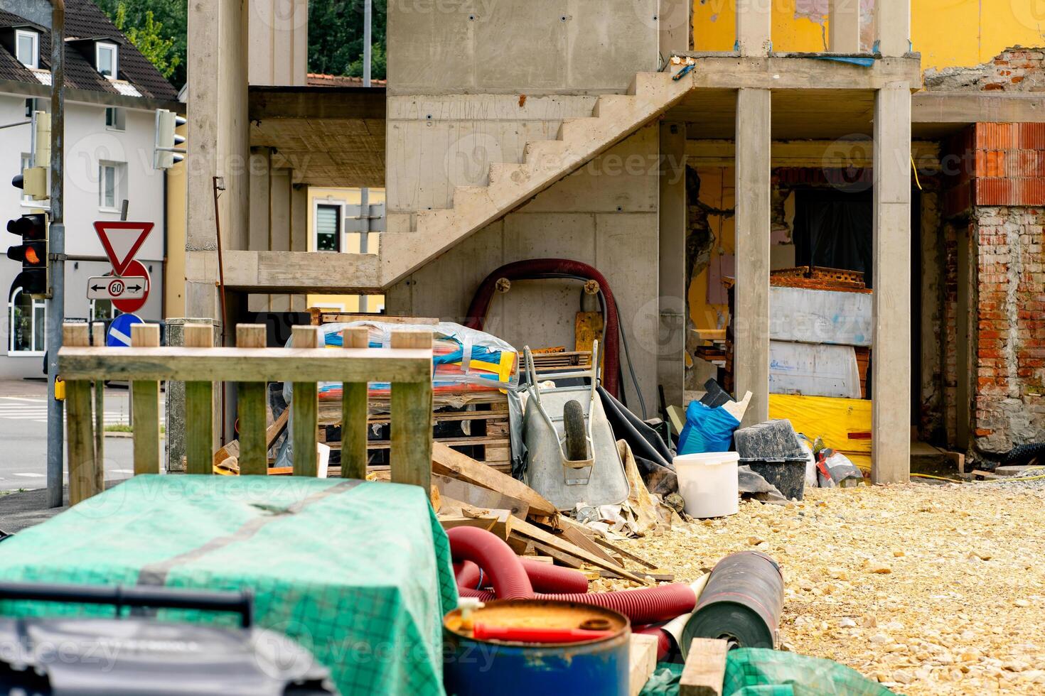 View of various building materials and fixtures near a house under construction photo