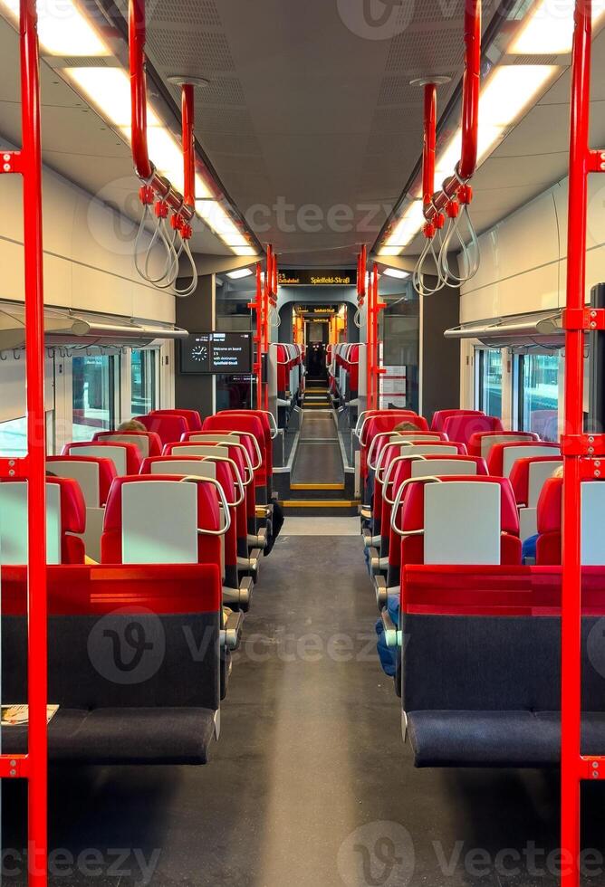 View of the rows of seats in a public transport carriage, train interior photo