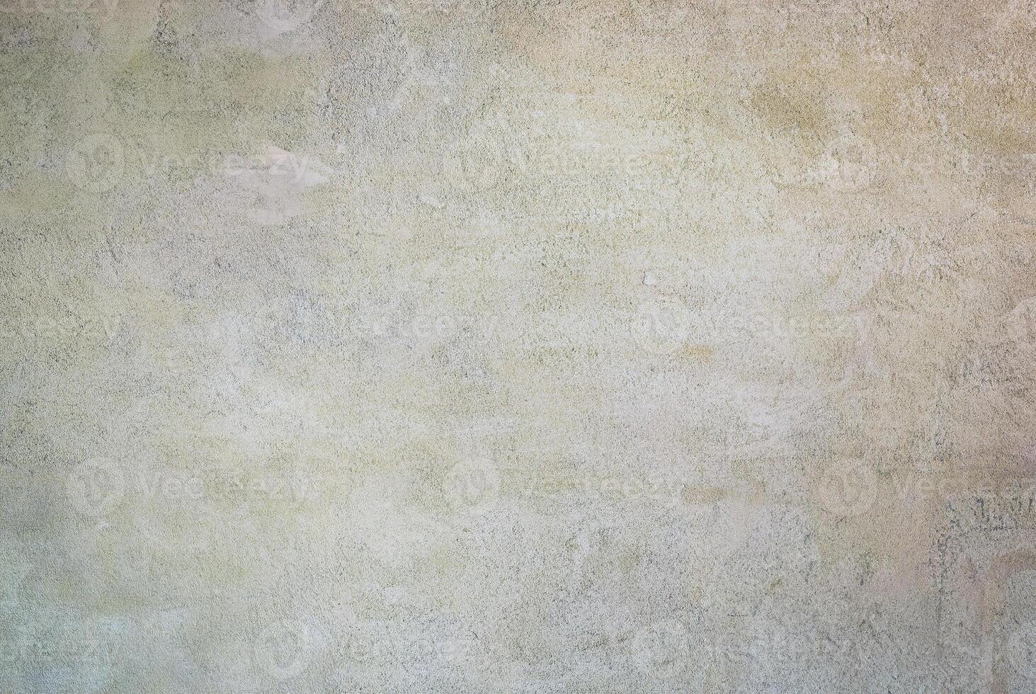 Neutral textured wall surface with soft beige and pastel tones, ideal for backgrounds and design templates. photo