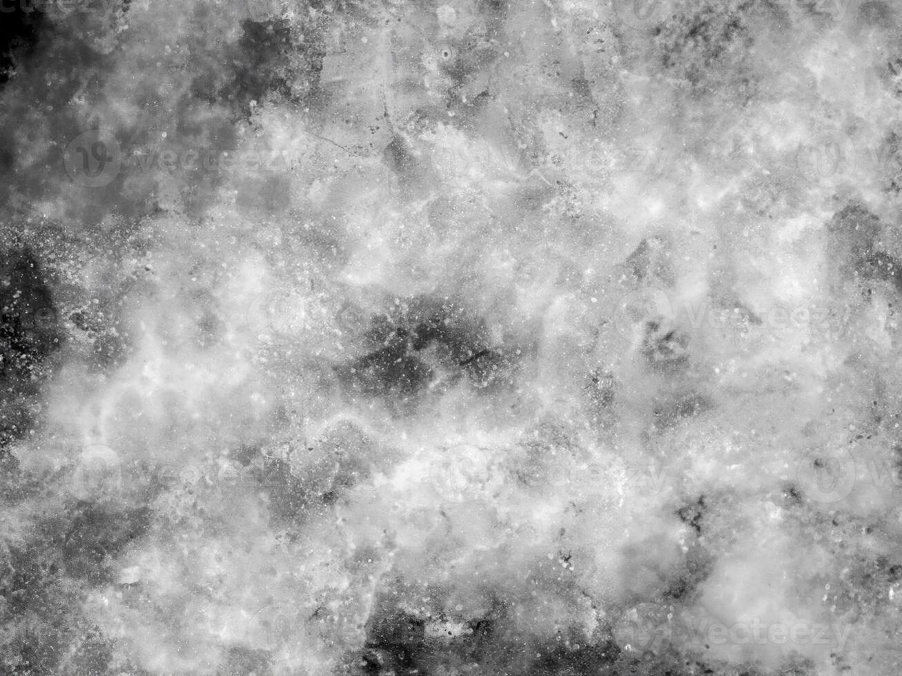 Abstract grunge texture featuring a cloudy marble-like pattern in black and white, with a speckled, starry appearance. Perfect for backgrounds, overlays, and design projects. photo