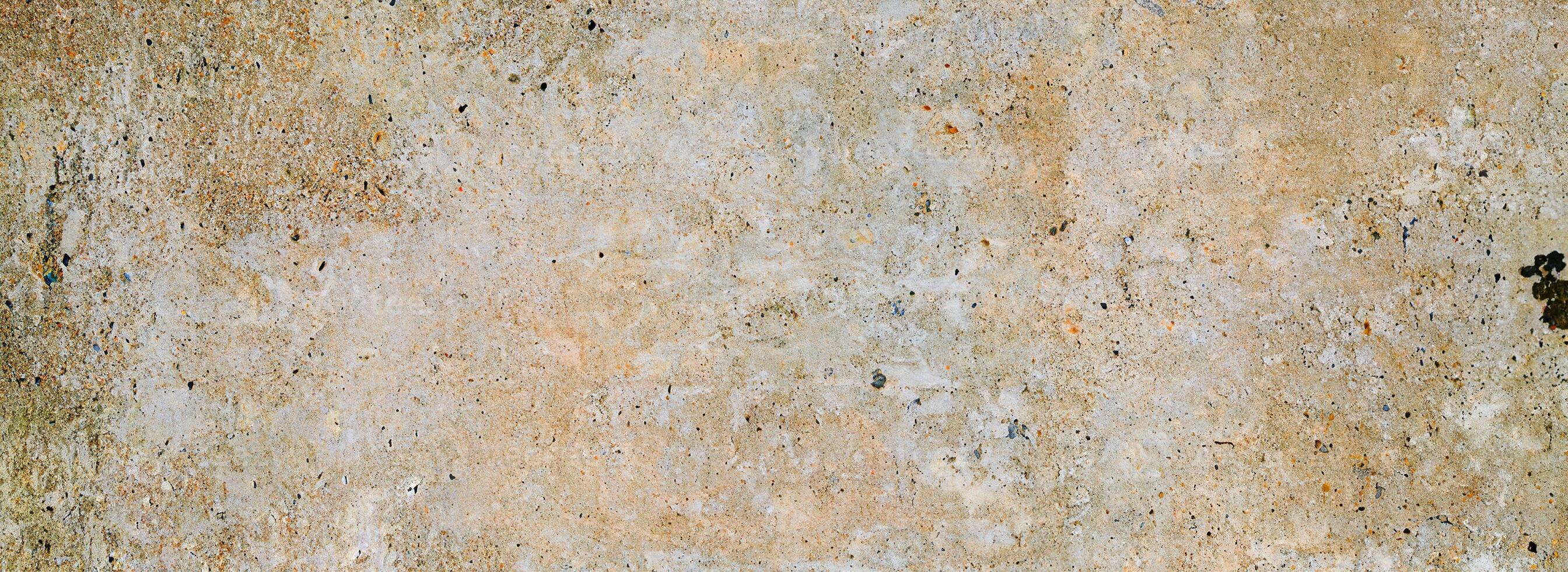 Rustic weathered concrete texture with earthy tones, cracks, and rough details, perfect for vintage design use. photo