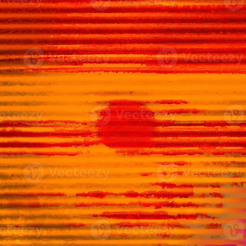 Vibrant abstract background with textured red and orange horizontal stripes resembling a grunge pattern. photo