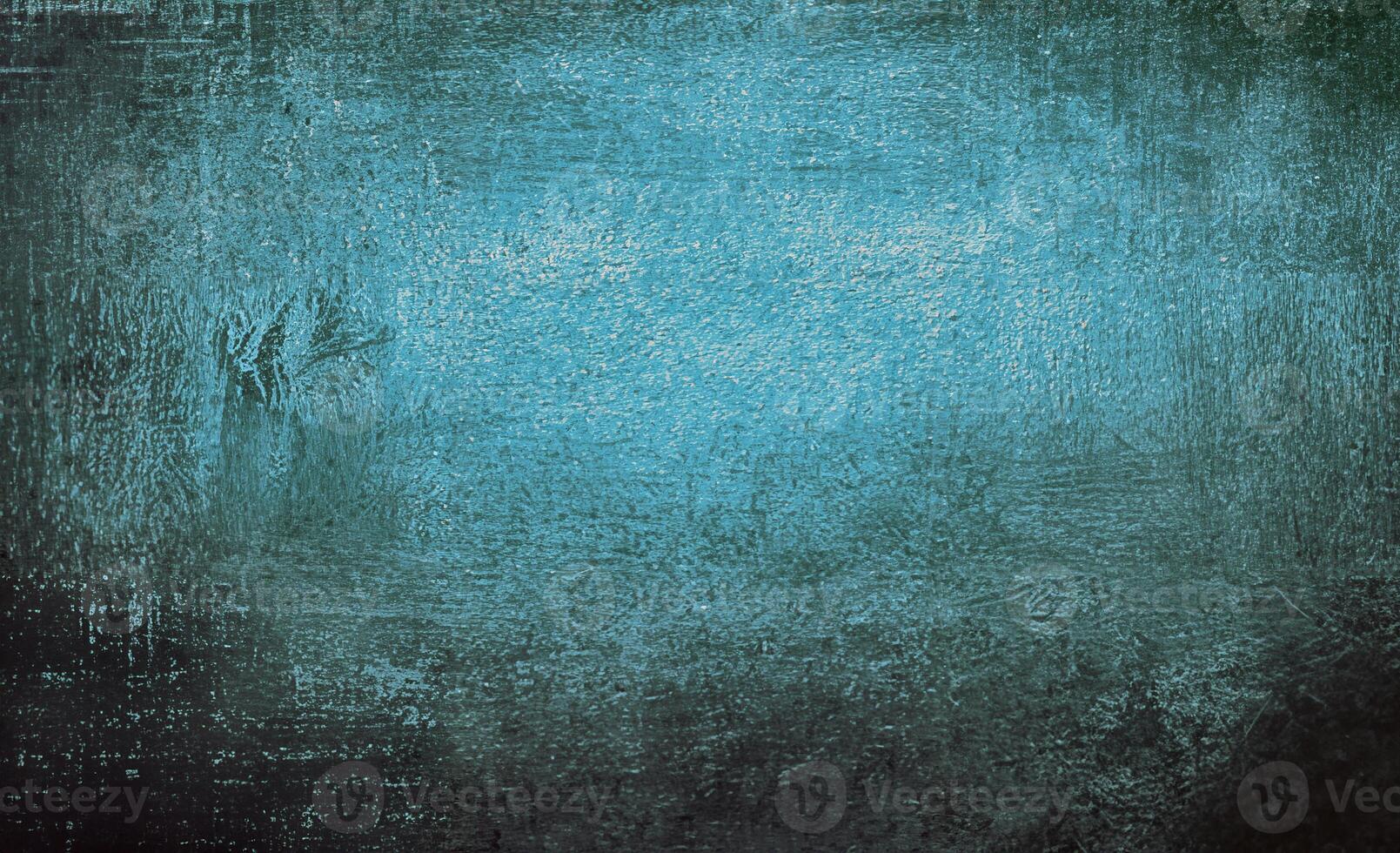 Abstract blue background with textured grunge effect, featuring rough patterns and faded gradient tones. photo