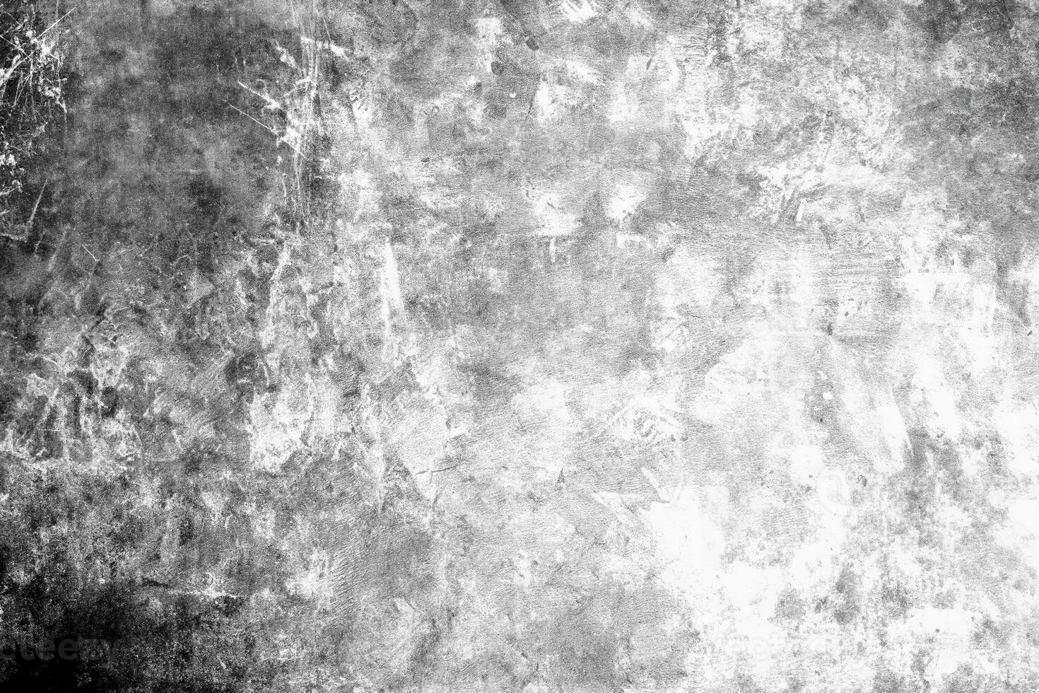 High-contrast grunge texture with rough, abstract patterns in black and white, ideal for backgrounds or overlays. photo