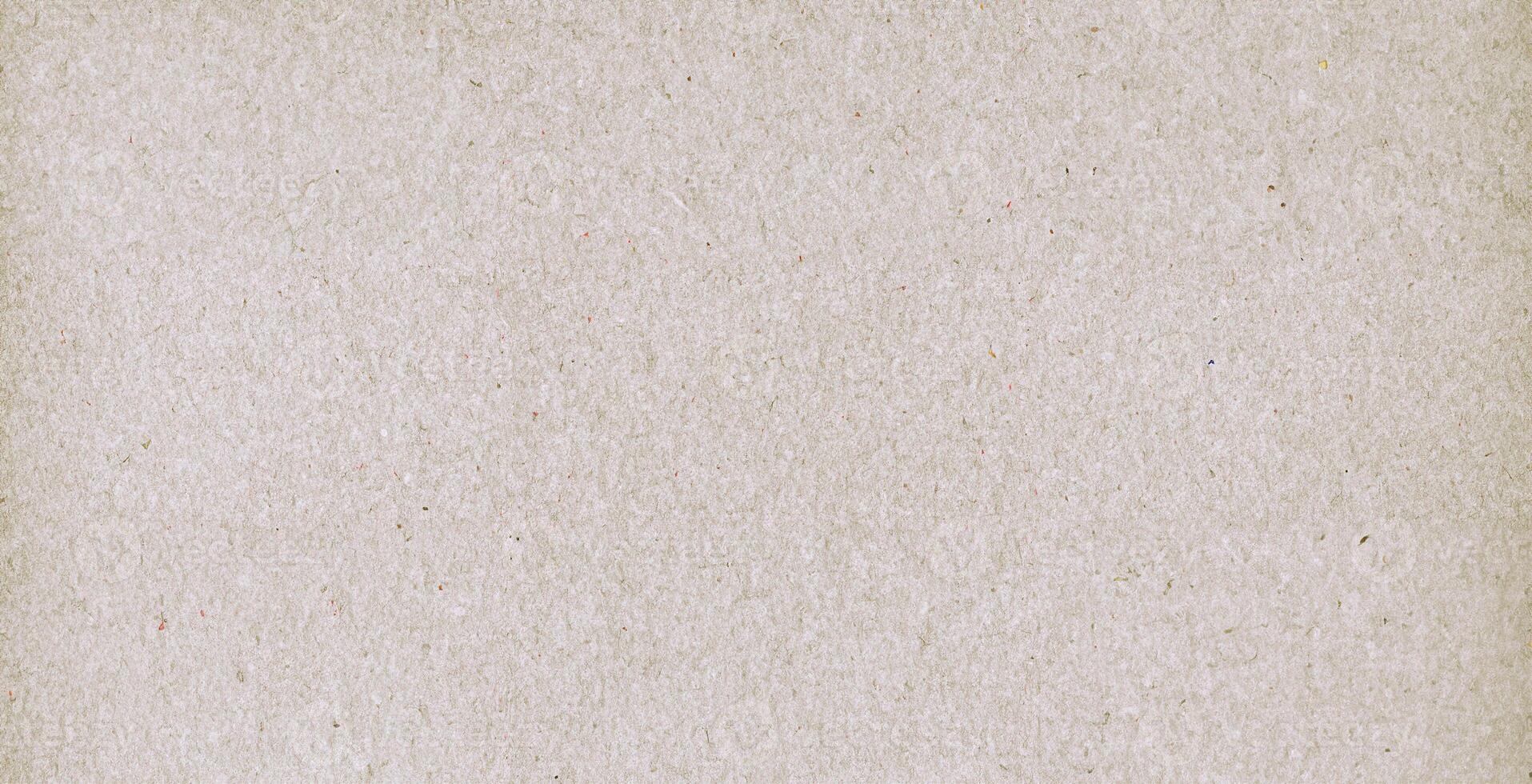 Close-up of a natural recycled paper texture with subtle fiber patterns, ideal for design and crafting projects. photo