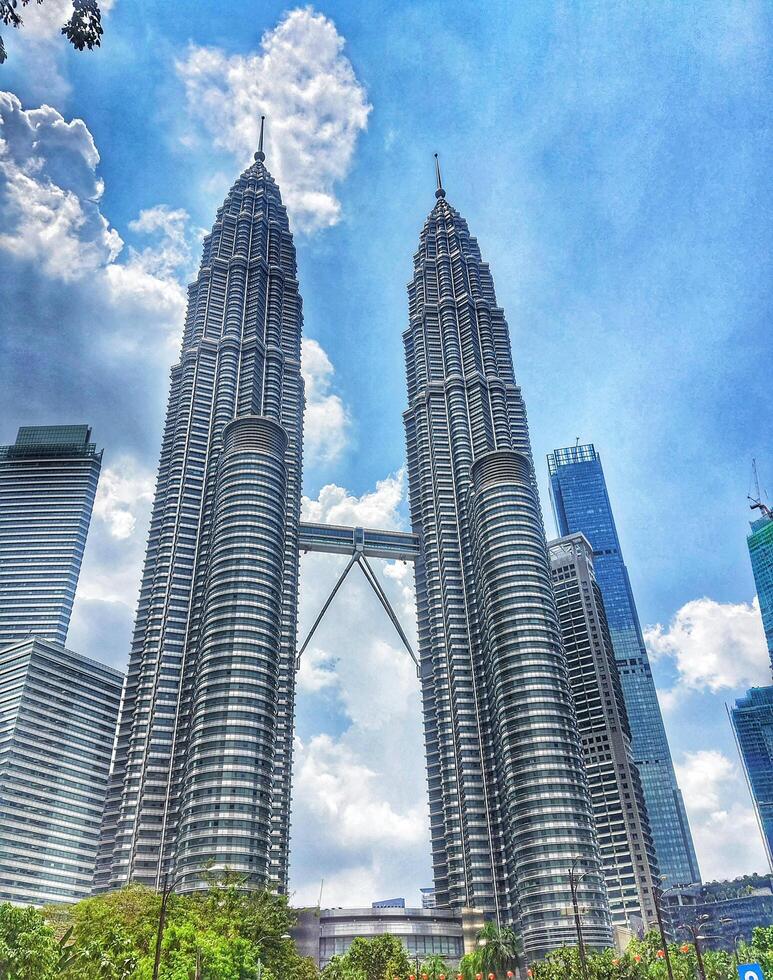 Kuala Lumpur, Malaysia on 21 February 2024. Majestic Petronas Towers Twin Skyscrapers Blue Sky Background photo