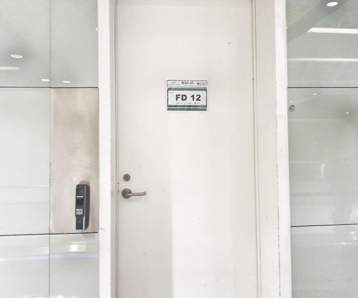 Jeddah, Saudi Arabia on 22 February 2024. White Office Door FD12 Access Card Reader Modern Minimalist Style photo