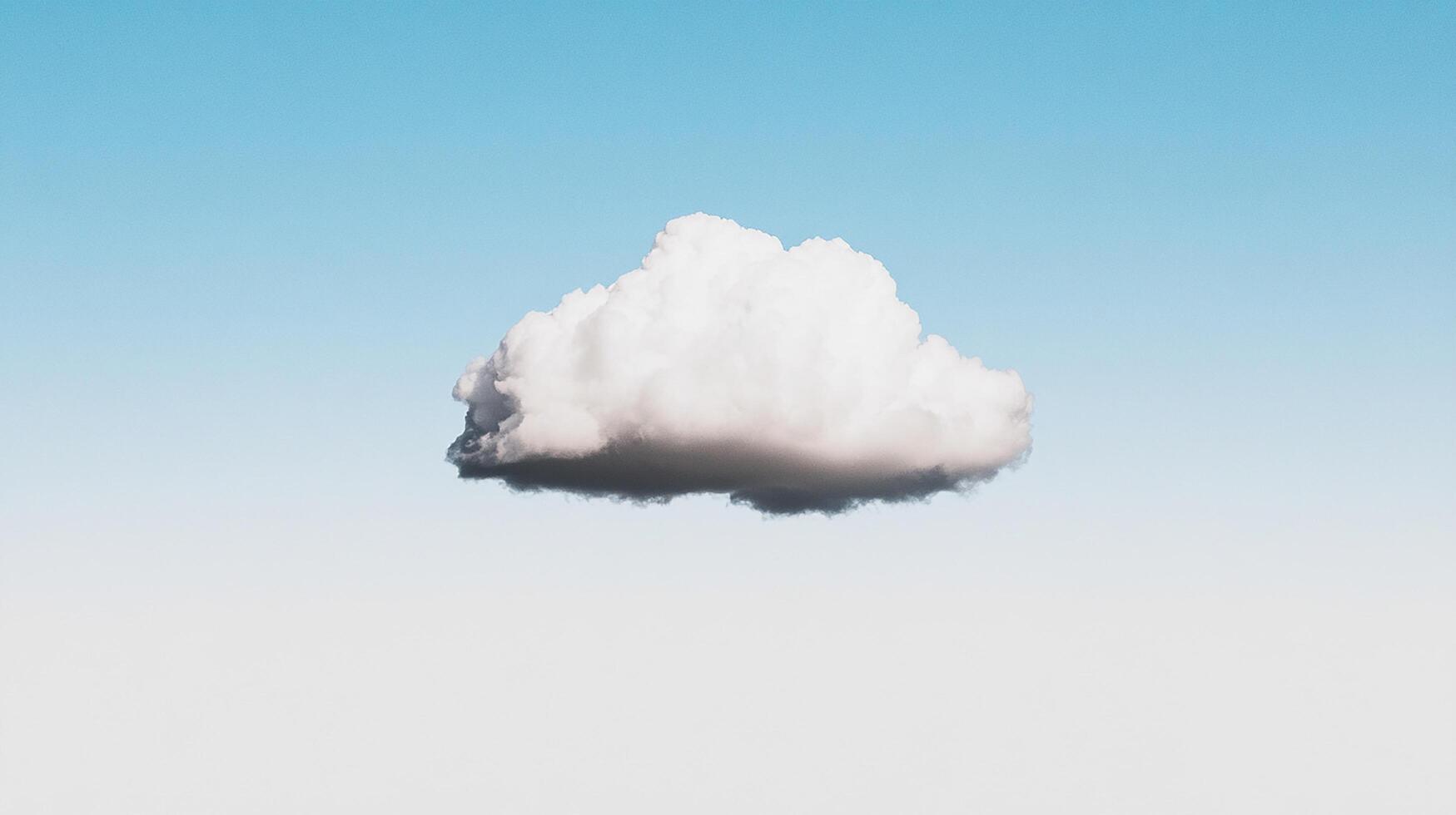 A solitary cloud floating in a clear blue sky. photo