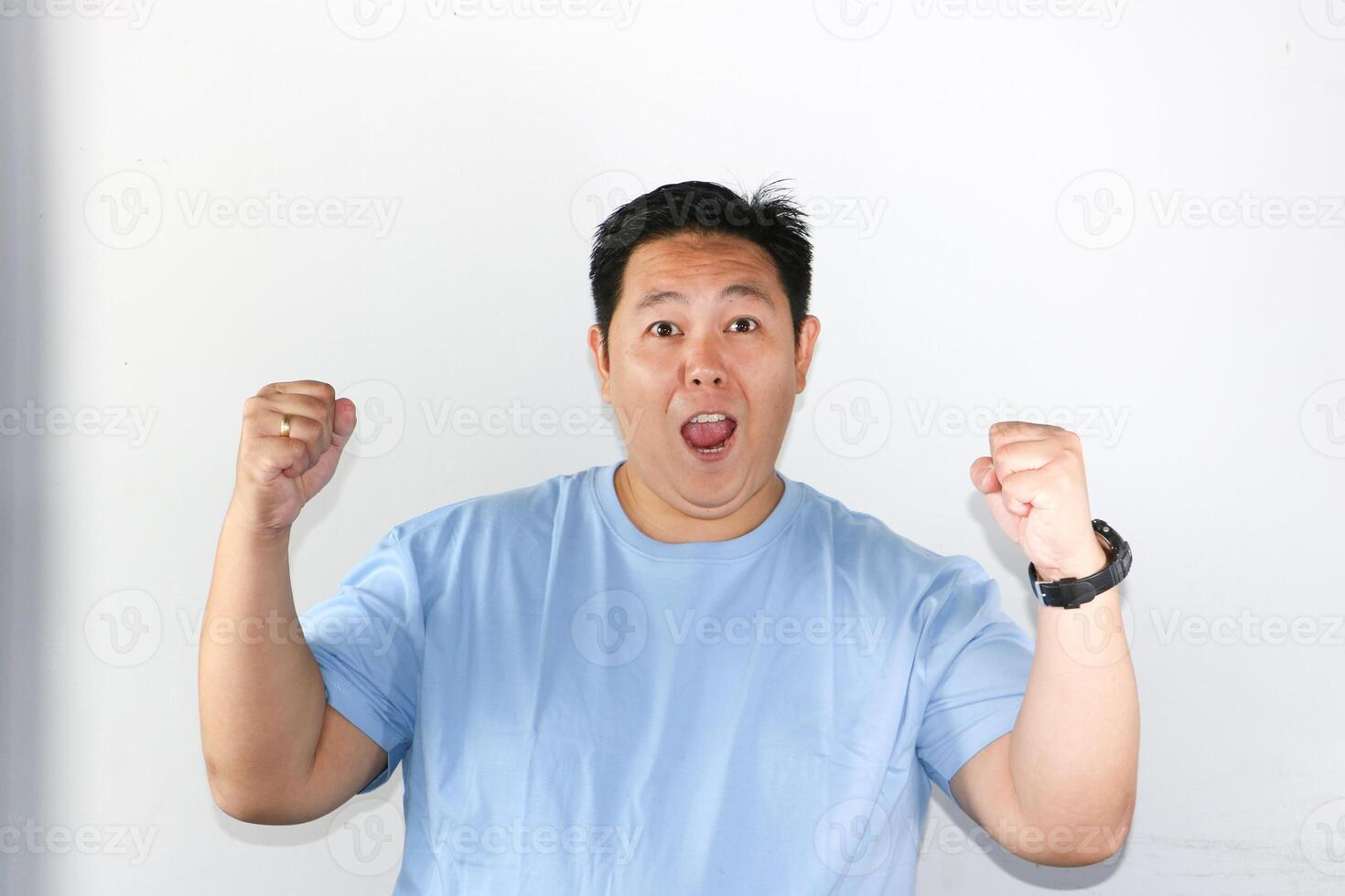 Happy and Excited Man with clenched his fist photo
