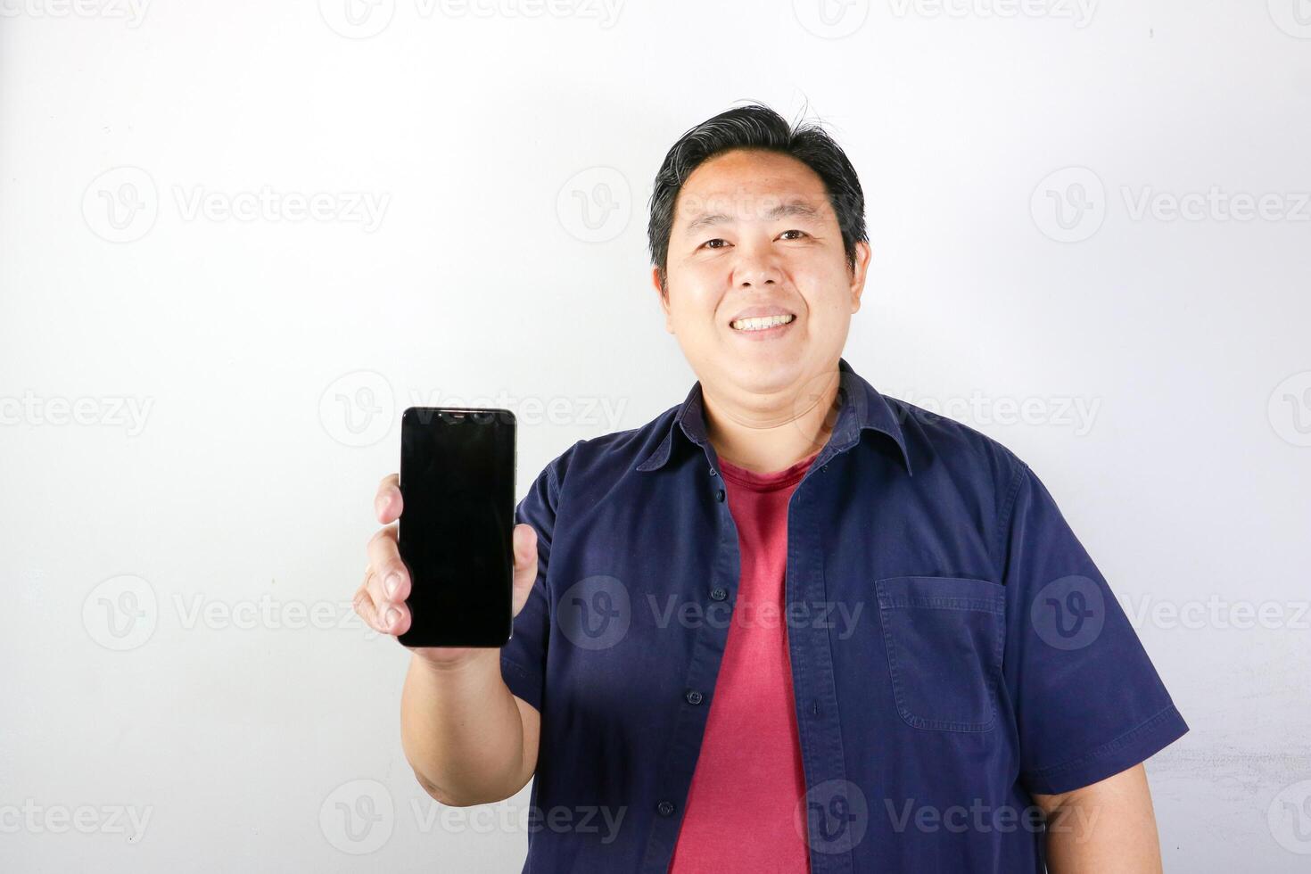 Cheerful Man Showing Smartphone facing to camera photo