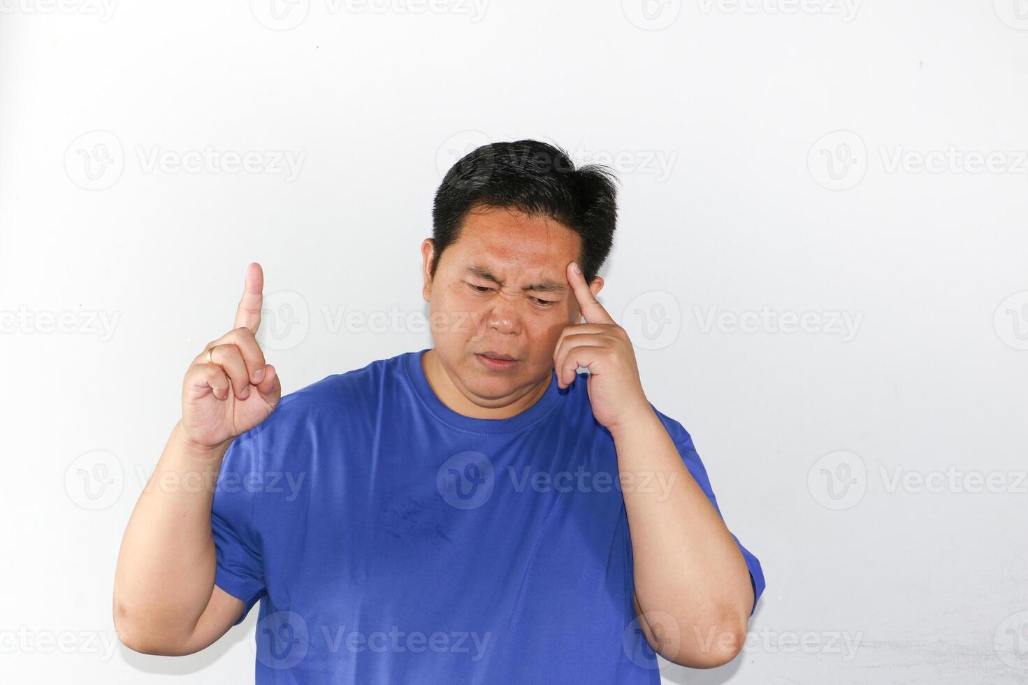 Man Thinking Deeply with one hand pointing to copy space photo