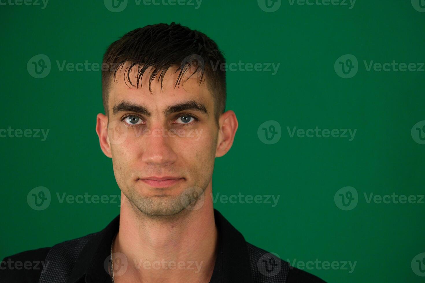 Photo of amazing guy indicating fingers up to empty space advising cool low shopping prices wear casual denim shirt isolated green color background