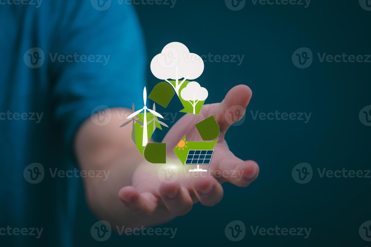 man holding a hand with a recycling symbol and green energy concept photo