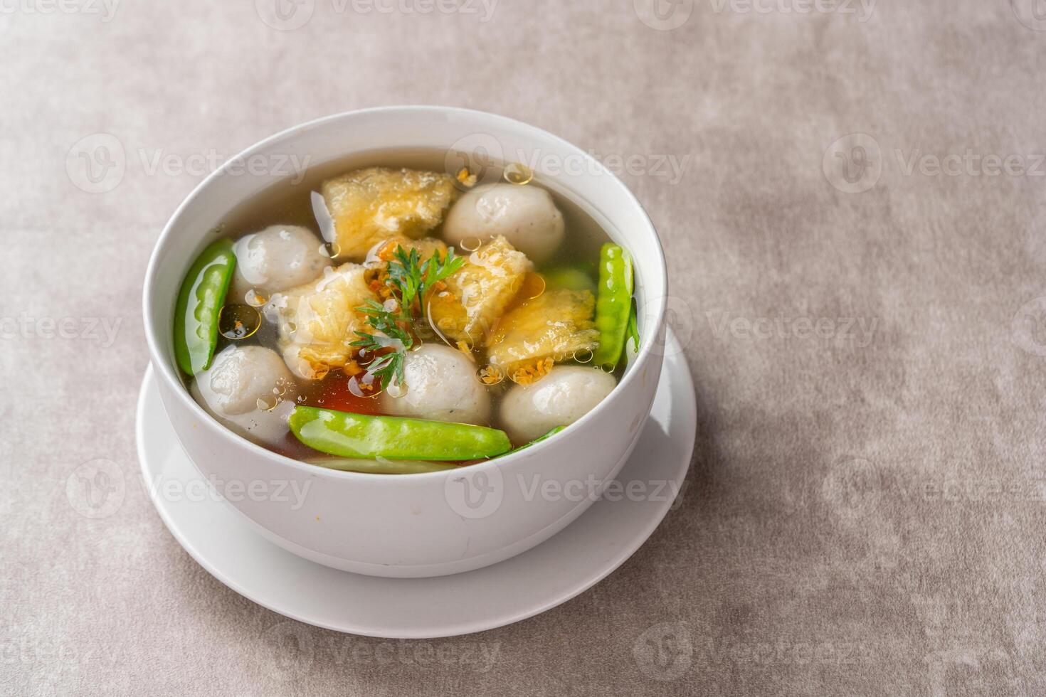 Fish Ball Soup with Fish belly crackers are called hipio. photo