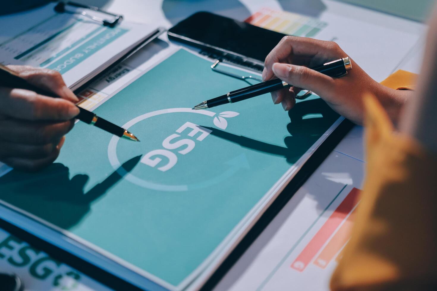 Business people working on a project with a dsg logo photo