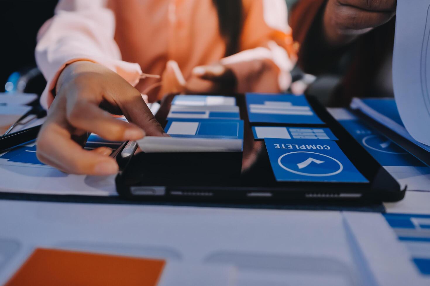 A person is using a tablet to make a presentation photo