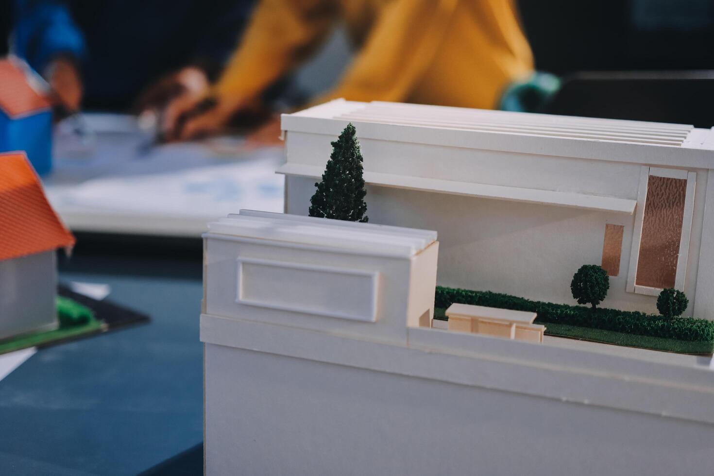 A model of a house is on a table photo