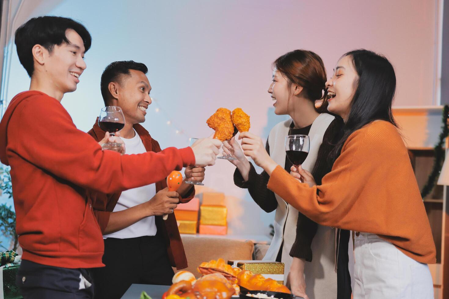 Four friends toasting with wine and food photo
