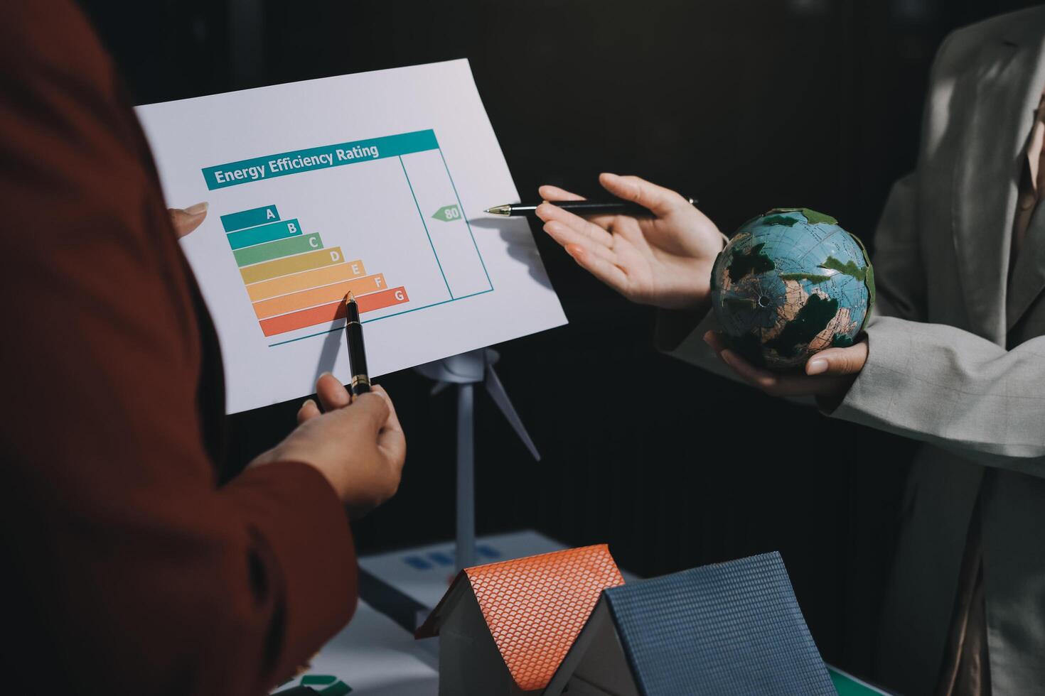 Business people holding a paper with a graph on it photo