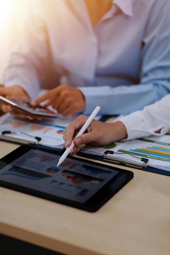 A person using a tablet computer at a desk photo