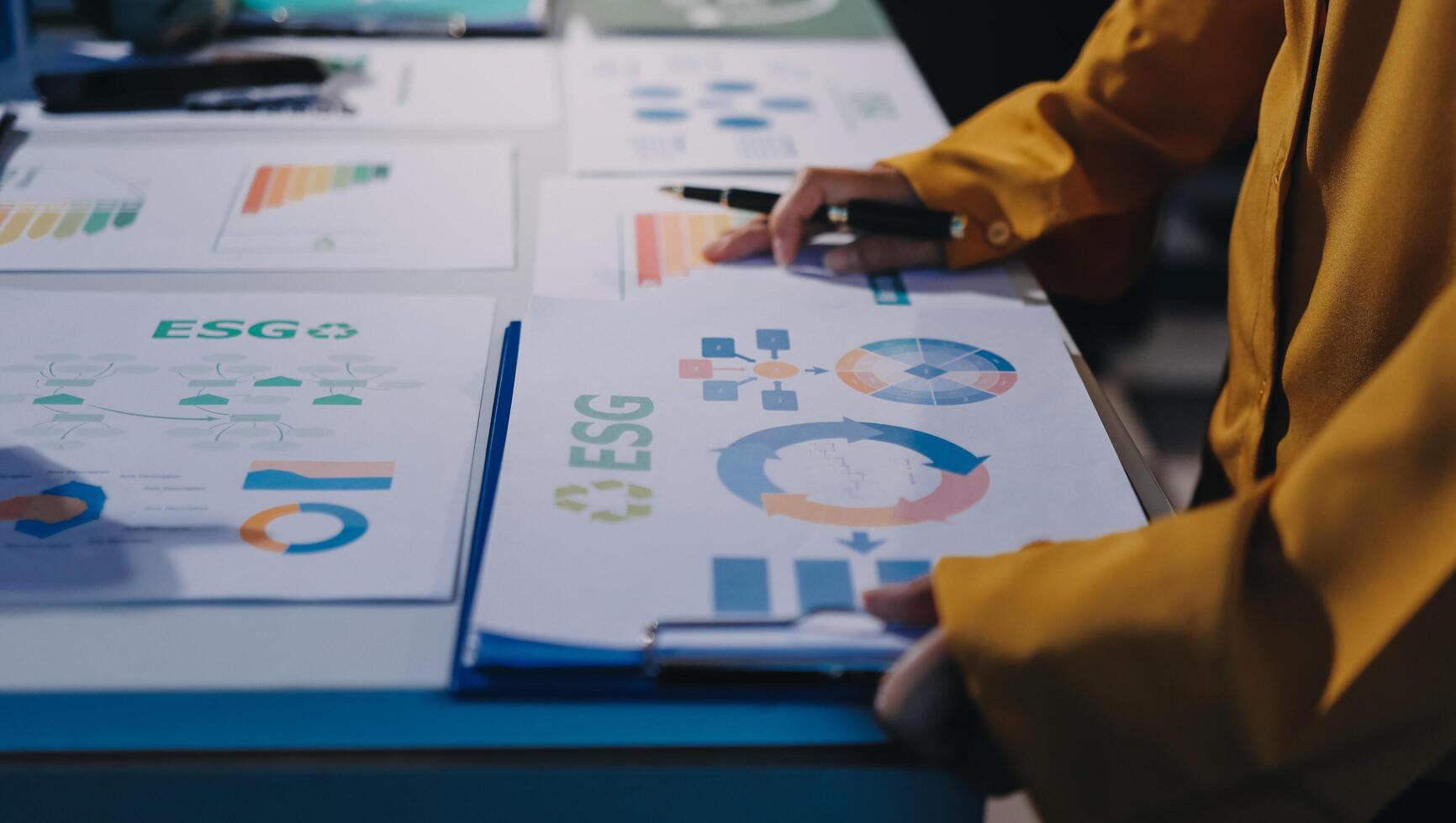 A person is looking at a chart on a table photo
