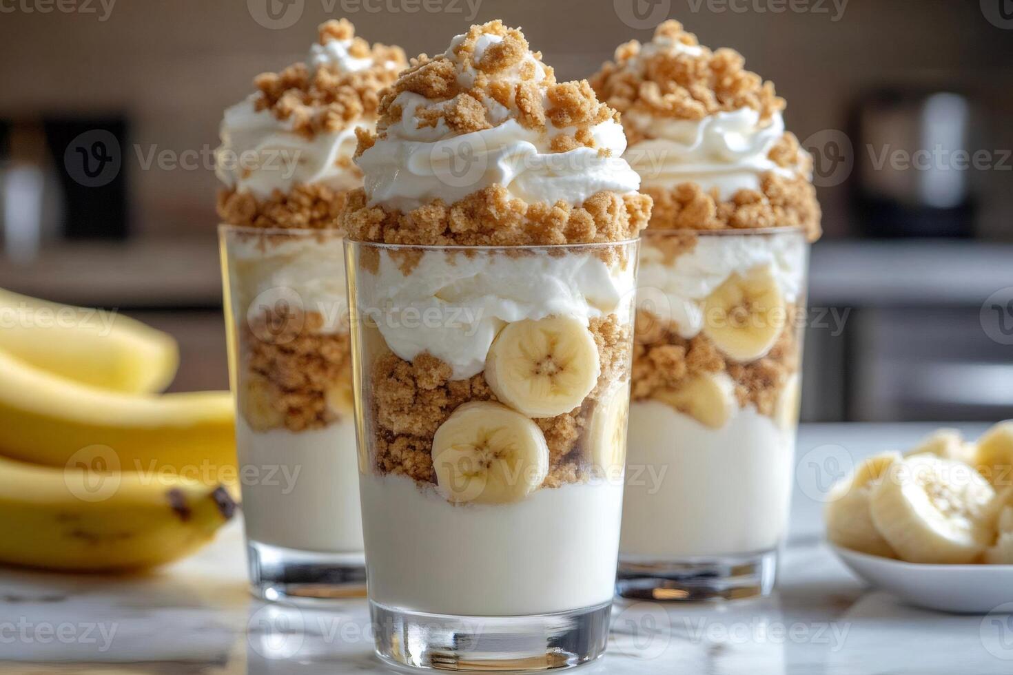 Delicious banana pudding parfaits with whipped cream and cookie crumbs are waiting to be eaten photo