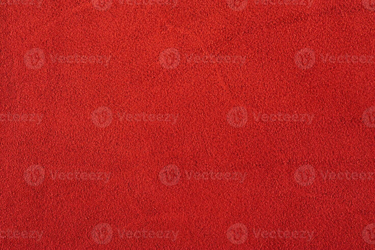 Red suede as a background macro photo. Red suede leather texture photo