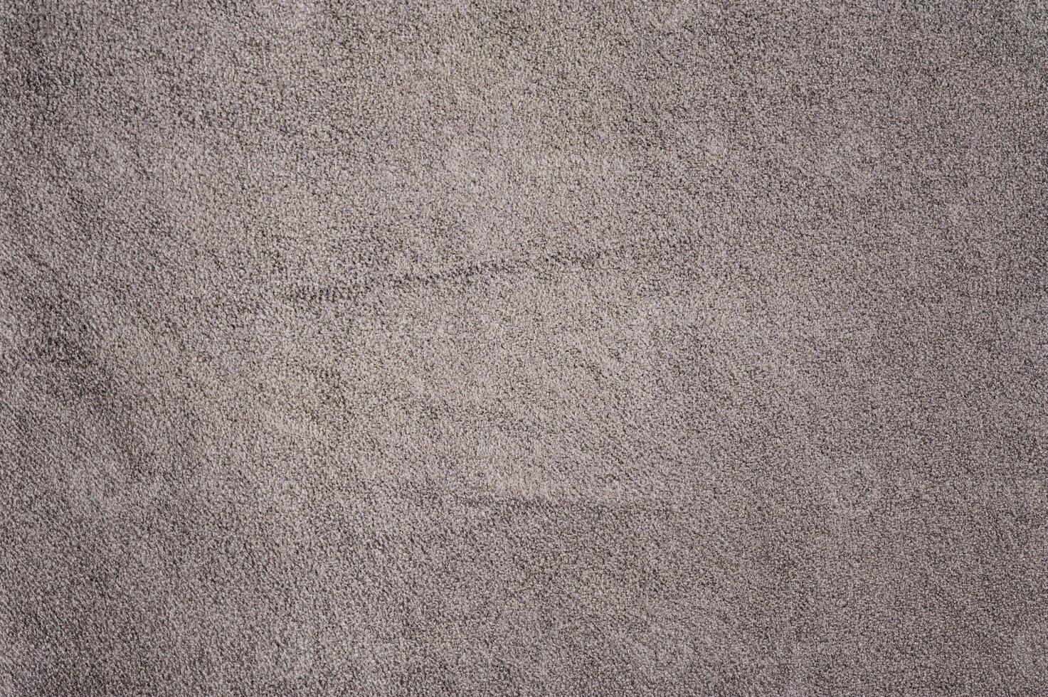 Gray suede leather macro photo as background.
