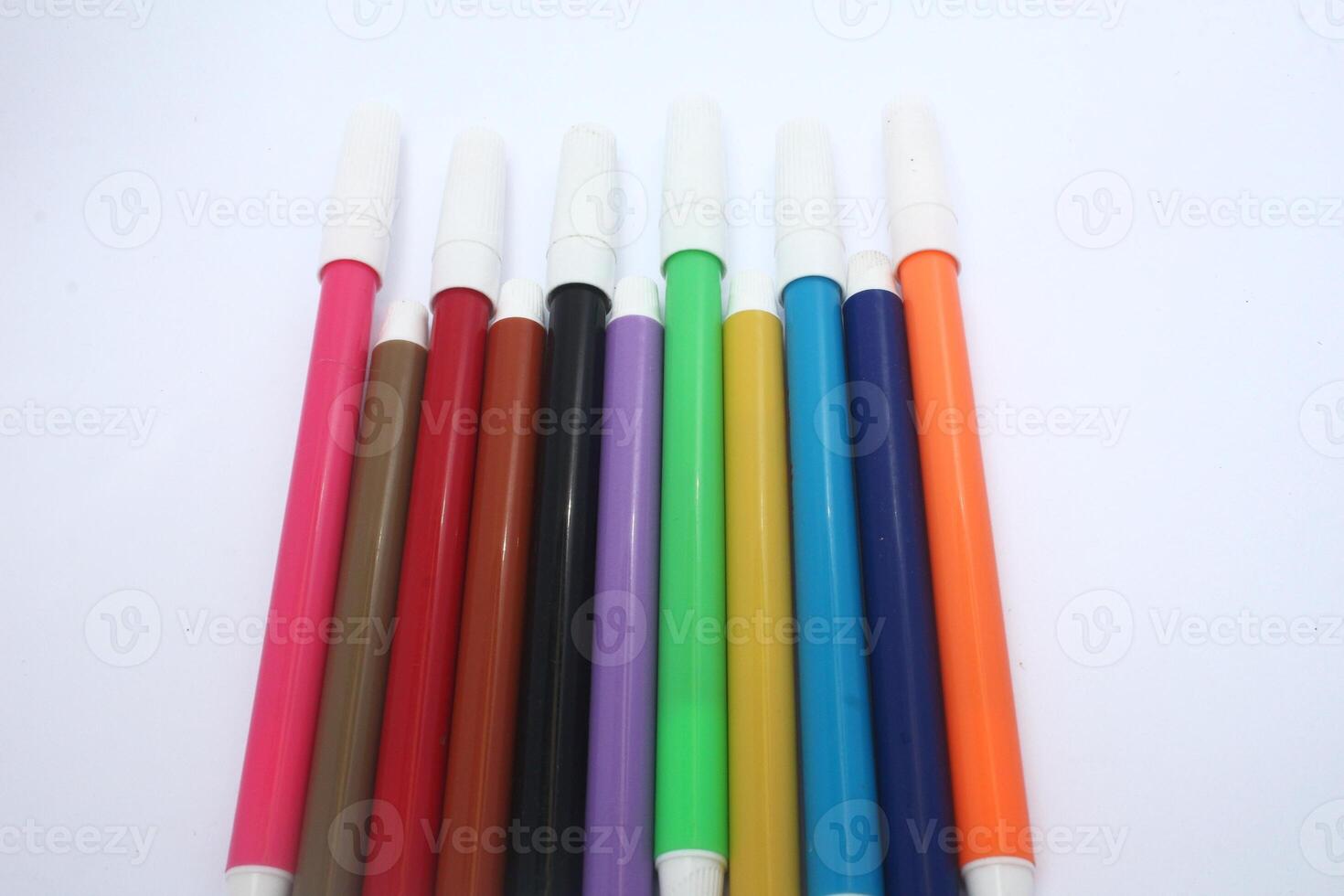 colorful markers isolated on white background, writing equipment, design, concept photo